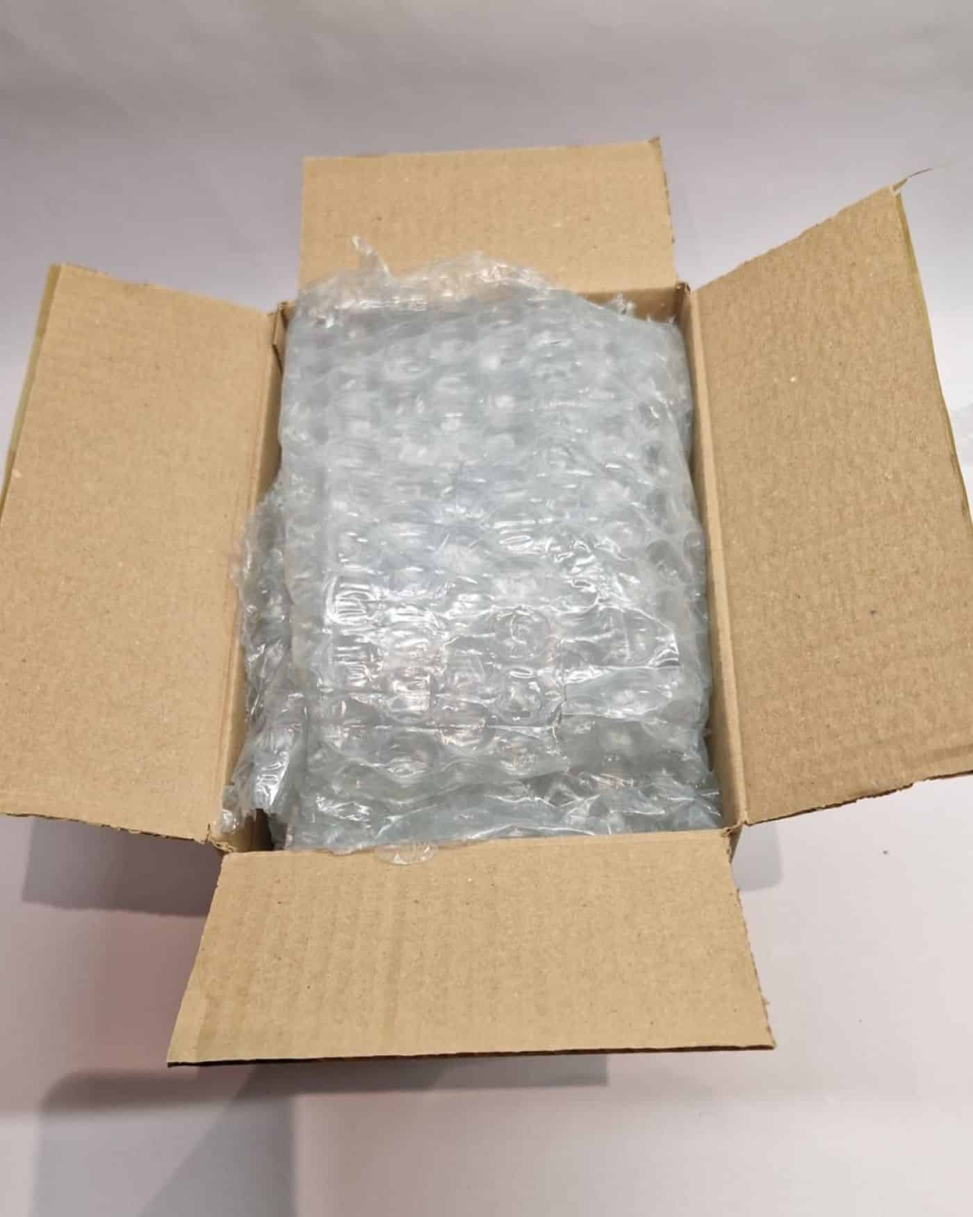 Outer box with protective packing peanuts for shock absorption